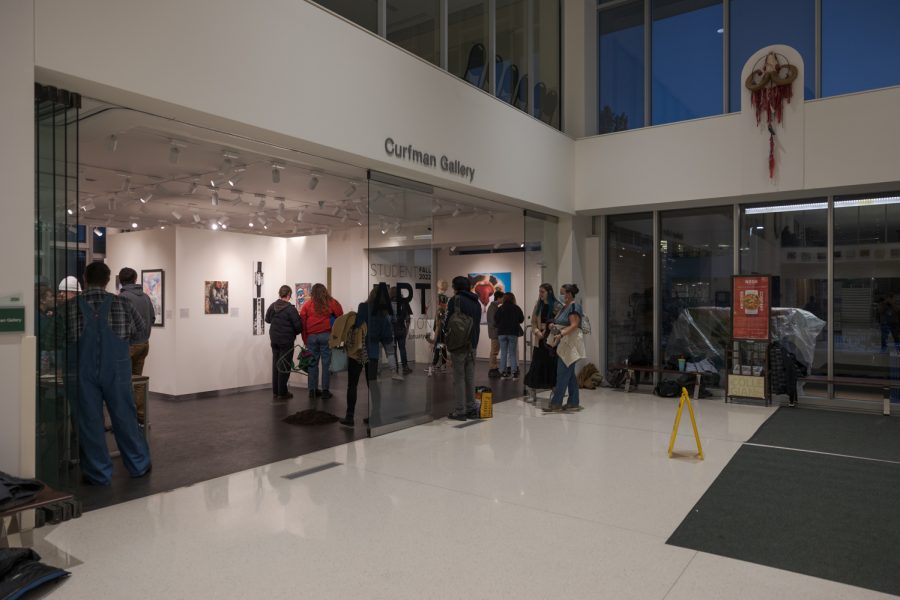 A crowd gathers at the Curfman Gallery in Colorado State Universitys Lory Student Center for the Student Art Exhibition