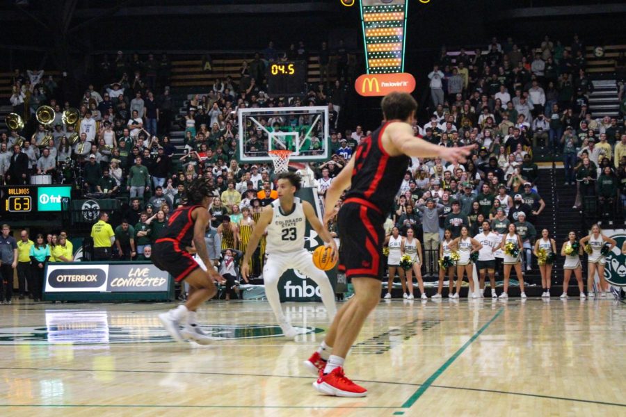 Isaiah Rivera (23), guard, dodges a player from Gardner-Webb University as he prepares to make the game winning shot Nov. 7. At the buzzer, Rivera scored two points for CSU making the score 65-63.