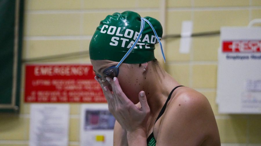 Colorado State swimmer Kendra Preski adjusts her goggles prior to competing in the 200 yard Fly against the University of Wyoming Nov. 5.
