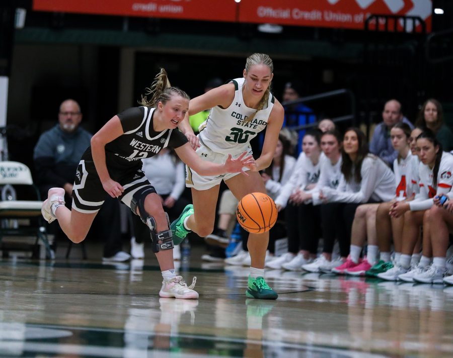 Colorado State University guard Hannah Ronsiek (30) tries to steal the ball from Western Michigan University possesion while WMU guard Alli Carlson (12) works to get it back at Moby Arena Dec. 3, 2022.