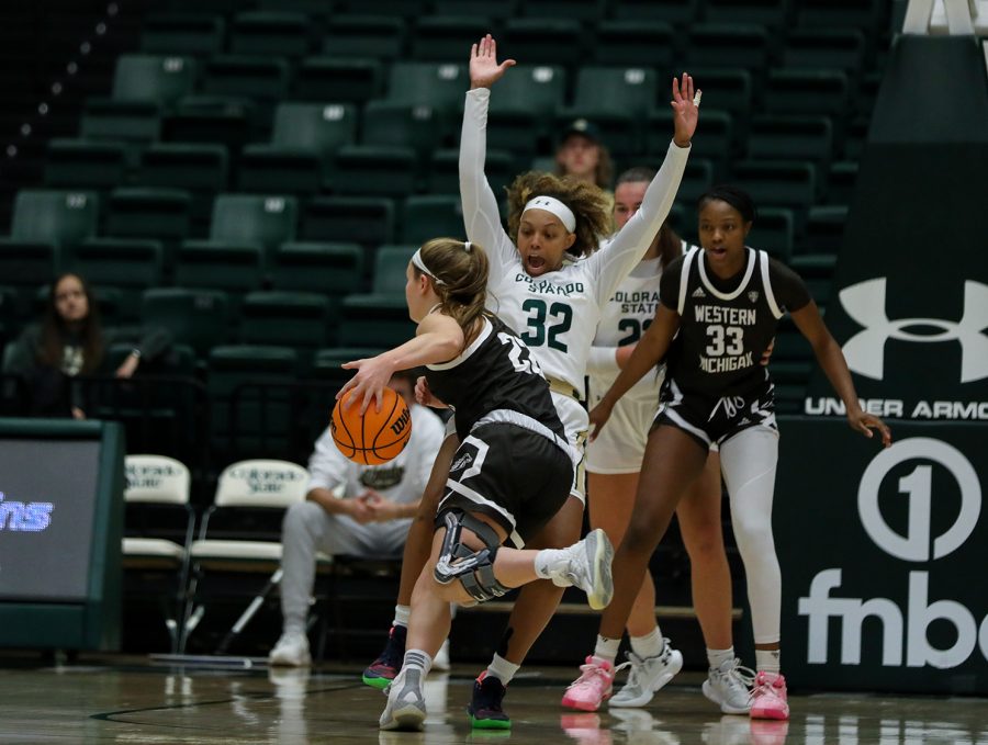 Redshirt junior Cailyn Crocker (32) takes a charge, giving possession back to the Rams during the Colorado State University women's basketball game against Western Michigan University Dec. 3, 2022. The Rams won 85-65.