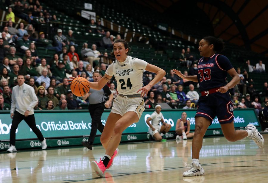 Colorado State University guard Sydney Mech (24) drives to the basket in front of California State University, Fresno guard Amaya West (33) at Moby Arena Dec. 29, 2022. The Rams beat the Bulldogs 64-58 in their first Mountain West Conference game of the season.