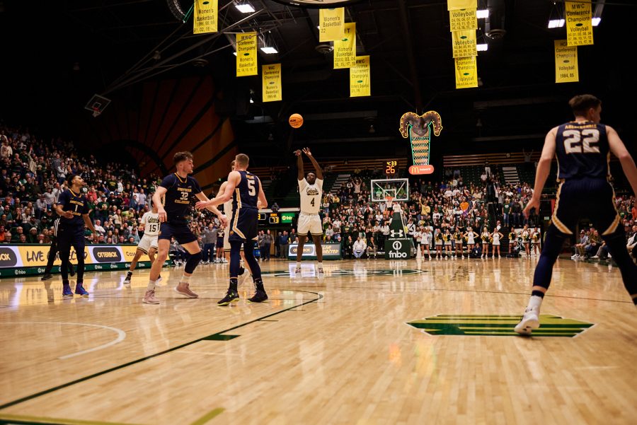 Guard Isaiah Stevens (4) shoots a three pointer at the home game against University of Northern Colorado Dec. 3. Stevens scored 3 out of 5 attempted three pointers against the Bears. Rams lost to the Bears by 5 points with a final score of 83-88.