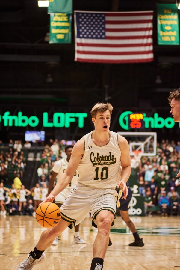 Forward James Moors (10) sets up for a two man play in the key at the home game against University of Northern Colorado Dec. 3. Moors scored 14 points against the bears setting him as the third highest scorer this game. Rams lost to the Bears by 5 points with a final score of 83-88.
