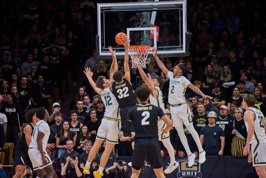 Forward Patrick Cartier (12), Guard Isaiah Rivera (23), and Guard Taviontae Jackson (2) go up to defend a layup attempt from University of Colorado Boulder. Cartier showed a strong defensive game in previous games and has continued to hold a strong defensive reputation. Colorado State University went on to lose with a final score of 65-93.