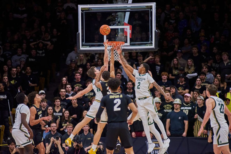 Forward Patrick Cartier (12), Guard Isaiah Rivera (23), and Guard Taviontae Jackson (2) go up to defend a layup attempt from University of Colorado Boulder. Cartier showed a strong defensive game in previous games and has continued to hold a strong defensive reputation. Colorado State University went on to lose with a final score of 65-93.