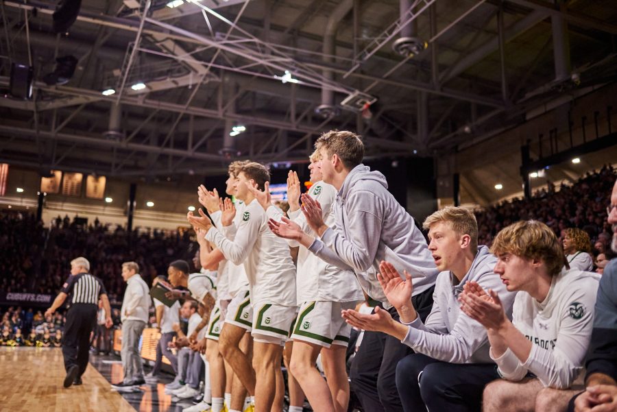 Colorado State University men’s basketball team celebrates a scored point at the University of Colorado Boulder away basketball game Dec. 8. Colorado State University lost with a final score of 65-93.