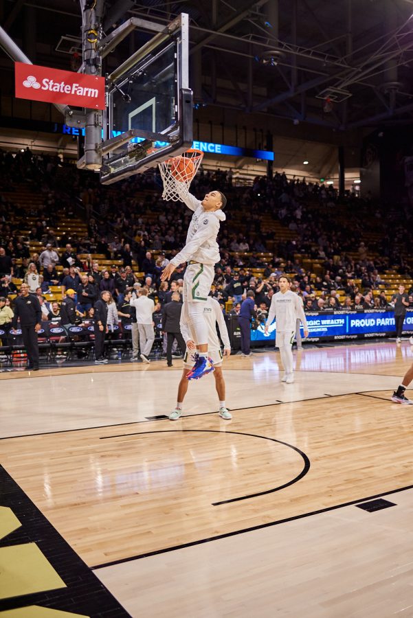 Guard John Tonje (1) dunks while warming up at the University of Colorado Boulder away basketball game Dec. 8. Colorado State University was losing at halftime with a score of 30-38 and went on to lose at a final score of 65-93.