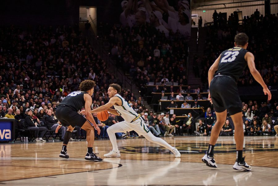 Guard Isaiah Rivera (23) takes a long first step to move around a defender at the University of Colorado Boulder away basketball game Dec. 8. Lake shot a 33% for two pointers made at the game. Colorado State University went on to lose with a final score of 65-93.