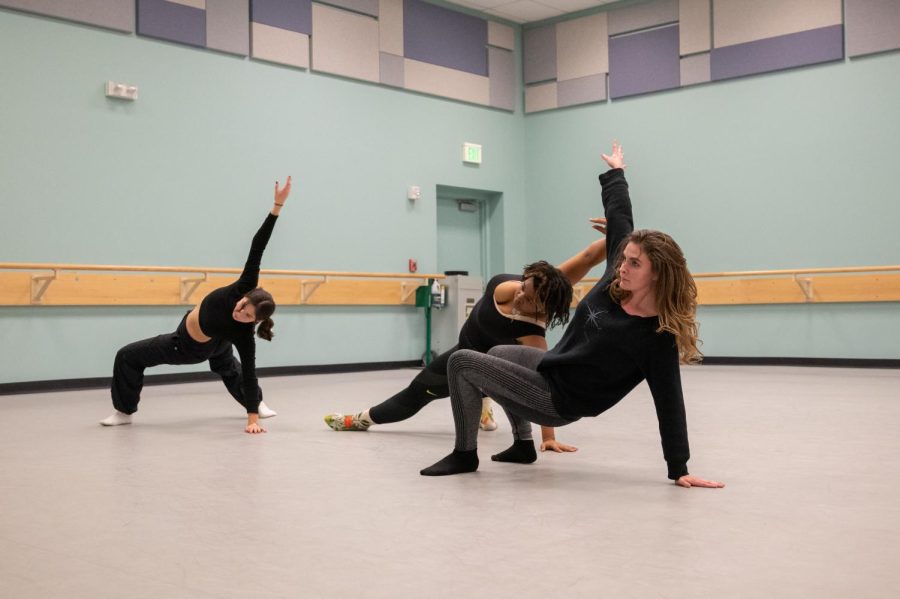 Nadia Henry, Ayanna Denning and Danielle Duncun practice their choreography to Hoziers, Would That I for their final project in Dance Techniques I: Modern, at studio 101 in the dance wing of the University Center for the Arts Dec 1.