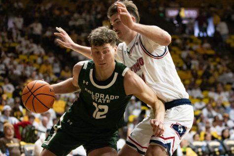 Colorado State forward Patrick Cartier fights off Wyoming forward Hunter Thompson (10) Jan 21.
