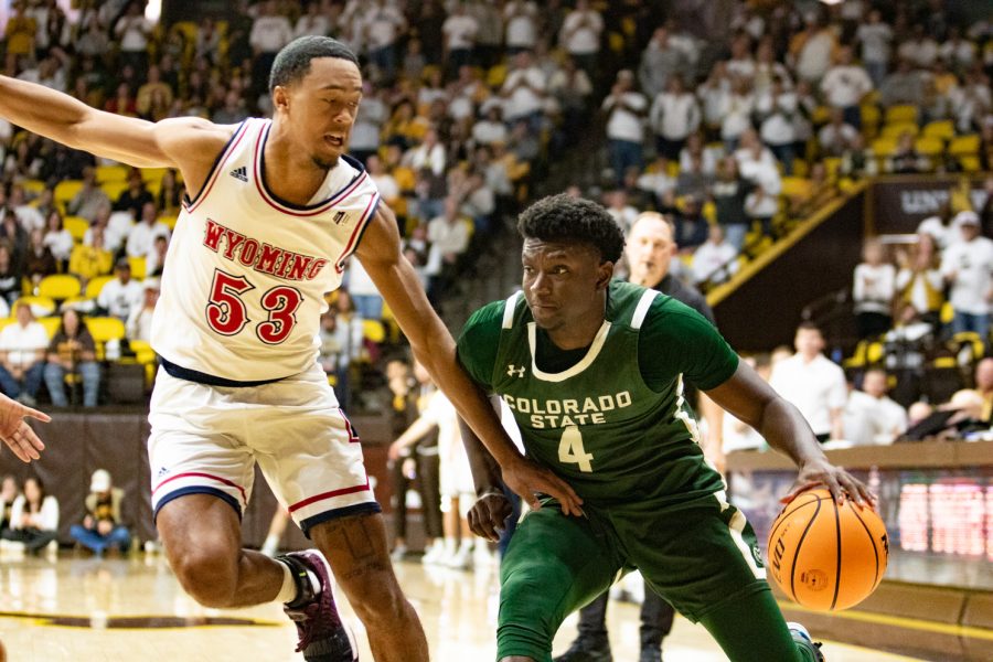 Colorado State guard Issaiah Stevens dribbles the ball as Wyoming guard Xavier DuSell defends Jan 21.