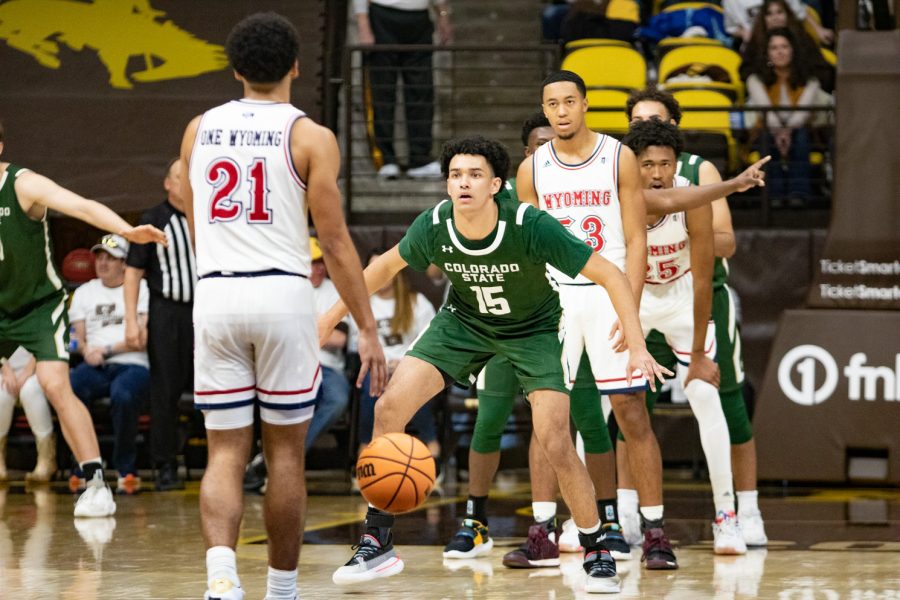 Colorado State guard Jalen Lake lines up to defend against Wyoming guard Noah Reynolds (21) Jan 21.