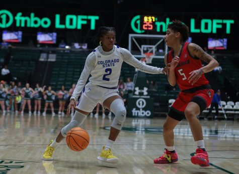 Colorado State University guard Destiny Thurman (2) pushes past LaTora Duff (5), a University of New Mexico guard, at Moby Arena Jan. 7, 2023. The Rams won 76-65. Thurman had a game-high 10 rebounds and four steals.