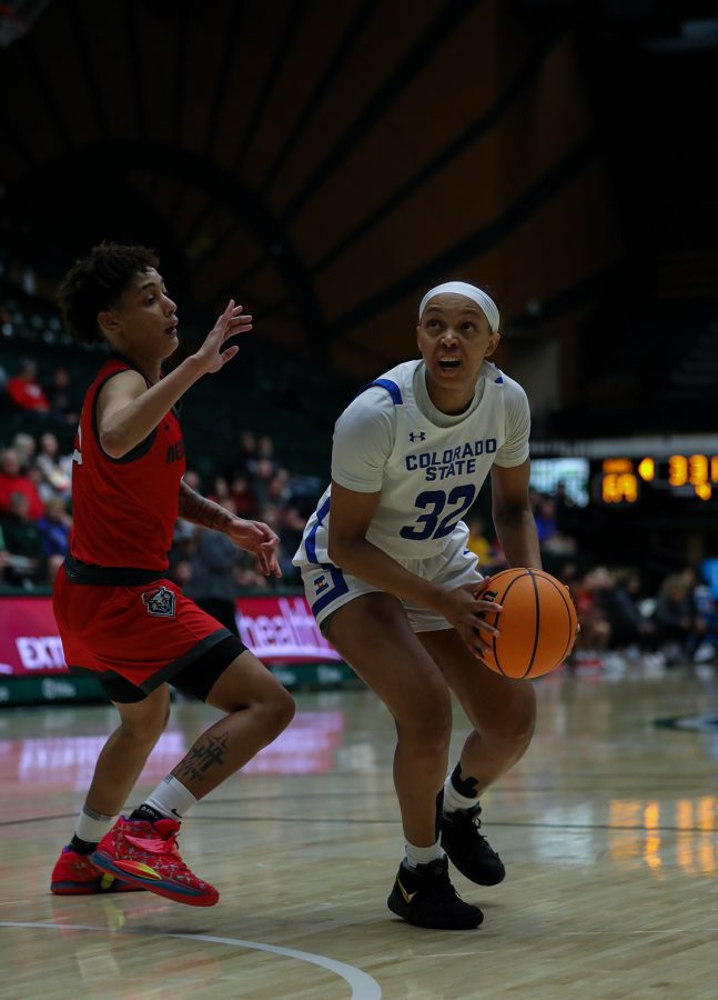 Colorado State University guard Cailyn Crocker (32) makes a basket against The University of New Mexico Lobos at Moby Arena Jan. 7, 2023. The Rams beat the Lobos 76-65 with Crocker putting up 16 points.