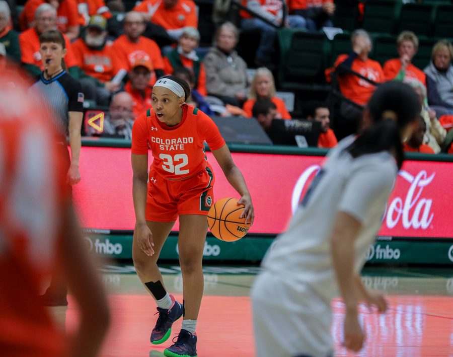 Redshirt junior Cailyn Crocker (32) brings the ball up the court at the Colorado State University game against the University of Nevada, Reno at Moby Arena Jan. 19, 2023. The Rams won 84-67 in the annual Aggie orange-out game.