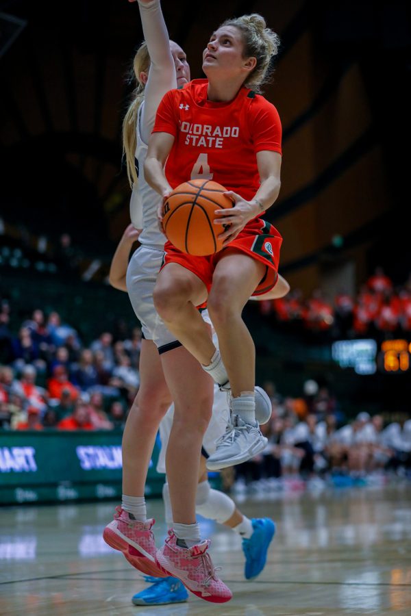 Colorado State University guard McKenna Hofschild (4) goes up for a shot against the University of Nevada, Reno at Moby Arena Jan. 19, 2023. CSU won 84-67 to go 6-1 in the Mountain West Conference. Hofschild, who was recently named to the Becky Hammon Mid-Major Player of the Year Award midseason watch list, recorded 17 points and seven assists.