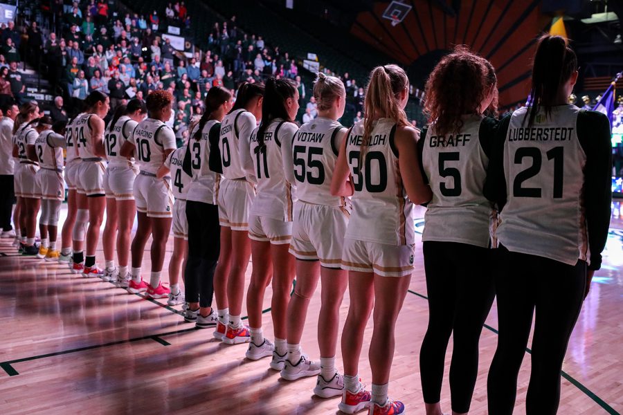 The+Colorado+State+University+womens+basketball+team+lines+up+for+the+National+Anthem+at+Moby+Arena+Jan.+21.+Each+player+wore+the+name+of+a+cancer+patient+on+their+jersey+for+the+fourth+annual+Fight+Like+a+Ram+game.
