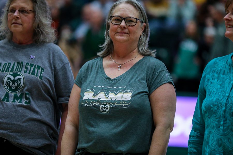 Kappa Kappa Gamma House Director Marilyn Votaw stands alongside other cancer patients during halftime of a Colorado State University women's basketball game at Moby Arena Jan. 21, 2023. As part of the fourth annual Fight Like a Ram game, CSU players wore the names of cancer patients on their jerseys and the Kappa Kappa Gamma sorority presented a check to the UCHealth Northern Colorado Foundation.