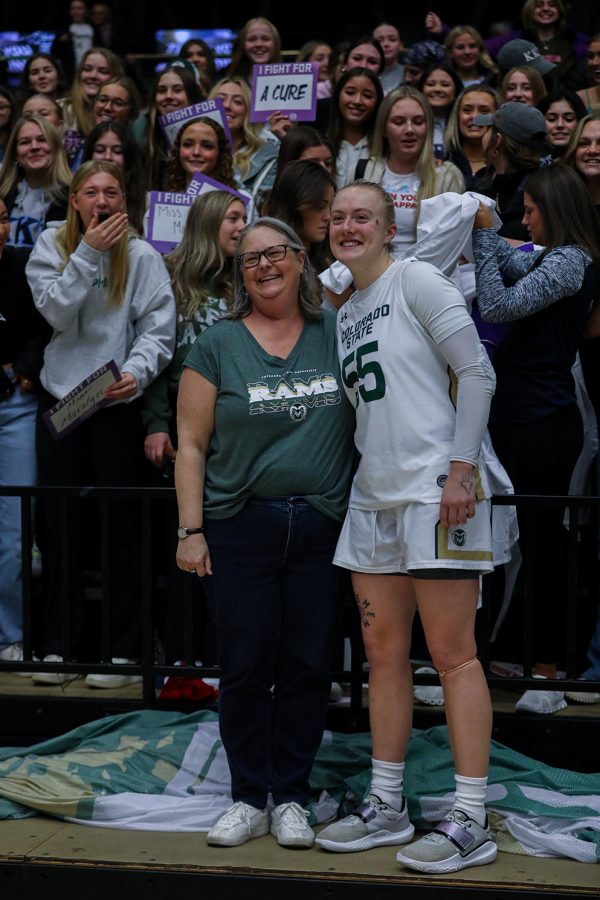 Marilyn Votaw and Meghan Boyd pose in front of Kappa Kappa Gamma sorority members after the Colorado State Unviersity women's basketball game at Moby Arena Jan. 21, 2023. Boyd wore Votaw's name on her jersey as part of the fourth annual Fight Like a Ram game, which honored area cancer patients.