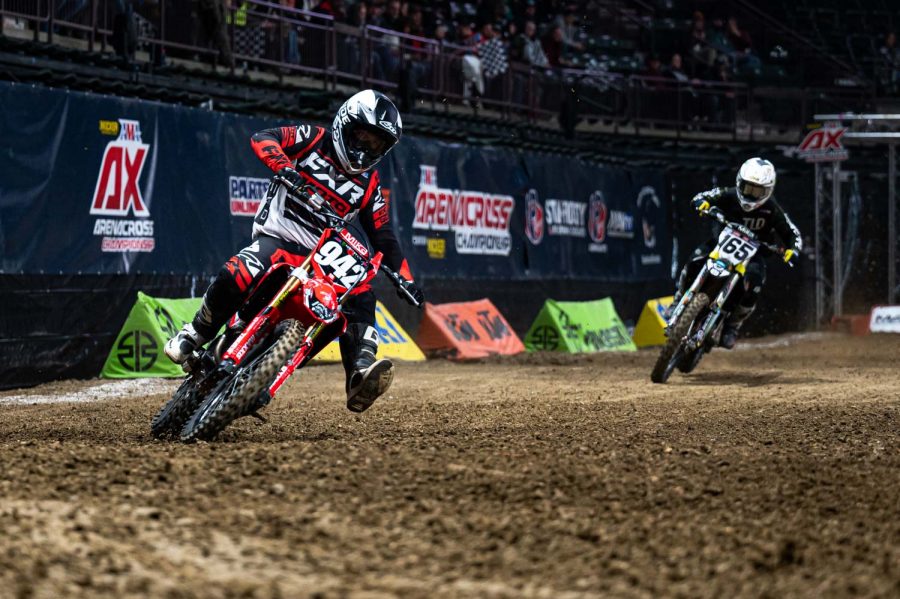 Deegan Hepp (942) sticks a foot out in preparation for the next turn during round three of the American Motorcycle Association Arenacross Championship at the Budweiser Events Center Jan. 6. Hepp is trailed by Jorge Rubalcava (165).