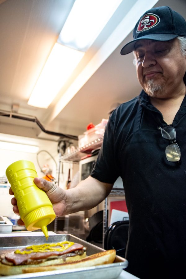 Frank Jimenez prepares a Media Noche sandwich at Babalu's Cuban Cuisine