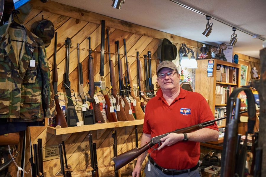 Peter Gracyalny, owner of Frontier Gallery, displays a 1897 Winchester rifle Jan. 24