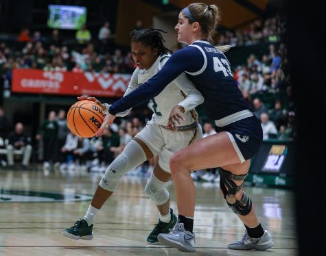 Colorado State University guard Destiny Thurman (2) pushes past Utah State University forward Ashya Klopfenstein (43) at Moby Arena Feb. 2, 2023. The Rams won 86-64, breaking a three-game losing streak.