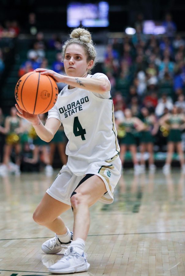 Senior guard McKenna Hofschild (4) throws a pass at the Colorado State University game against Utah State University at Moby Arena Feb. 2, 2023. The Rams beat the Aggies 86-64. Hofschild led the team in scoring with 21 points.