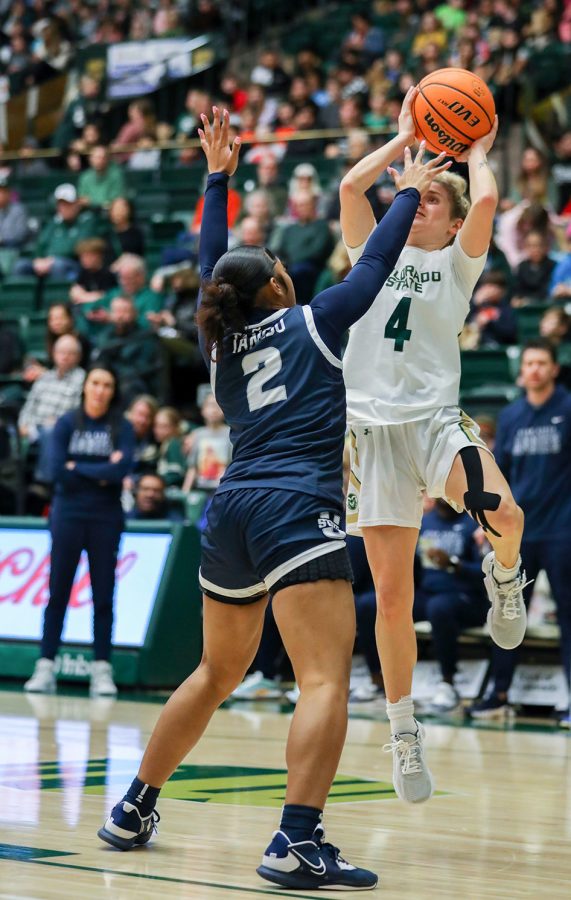 Colorado State University guard McKenna Hofschild (4) takes a jump shot above Utah State University guard Isabella Tanedo (2) at Moby Arena Feb. 2, 2023. The Rams won 86-64.