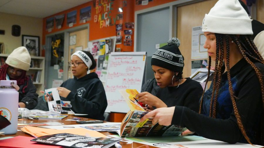 Students in the Black/African American Culture Center office craft vision boards with the help of Bridgette Johnson, assistant vice president at The Office of Inclusive Excellence Feb. 15. 