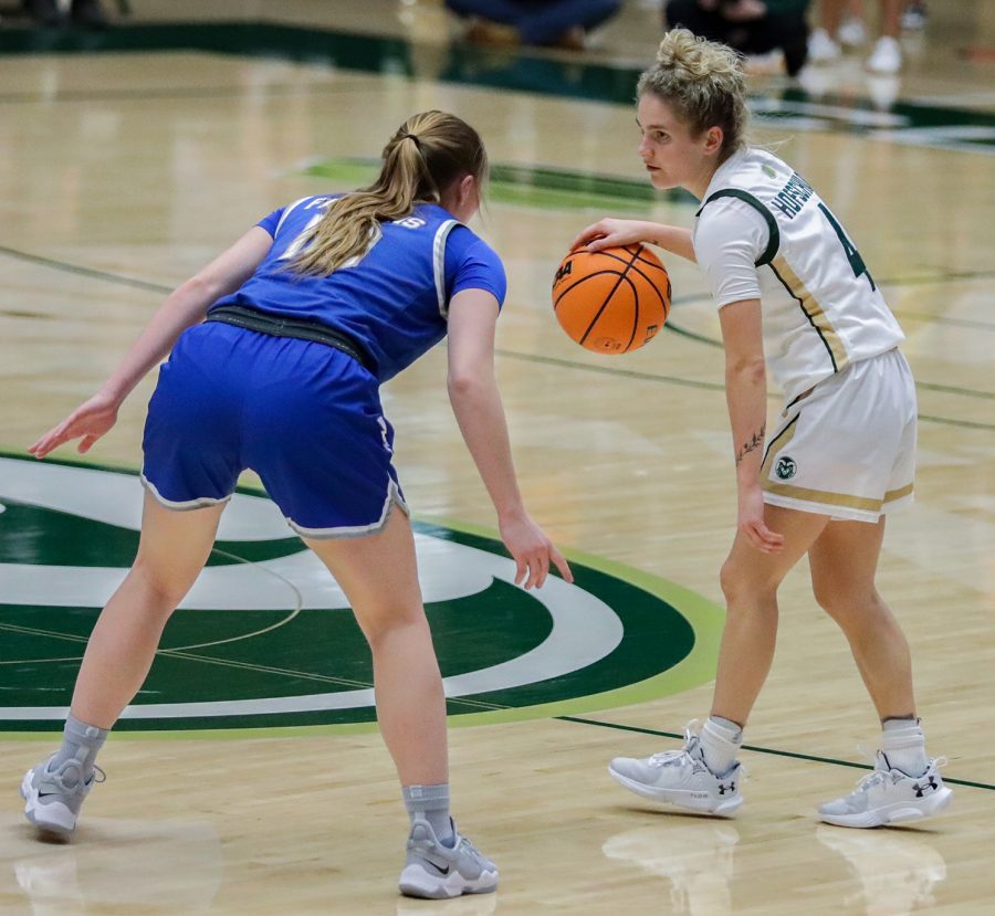 Colorado State University guard McKenna Hofschild (4) faces off with United States Air Force Academy guard Kamri Heath (10) at Moby Arena Feb. 18, 2023. The Rams won 67-64. Hofschild led the team in scoring with 25 points and added a game-high eight assists.