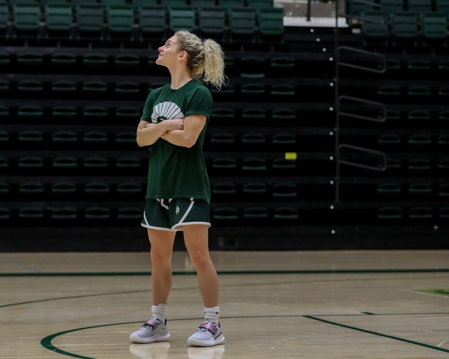 McKenna Hofschild gazes up at Becky Hammons name and jersey number (25) in the rafters of Moby Arena after a womens baketball practice Feb. 21, 2023. Hofschild is a senior point guard for Colorado State University and is on the shortlist for the Becky Hammon Mid-Major Player of the Year award. Hammon played for the Rams in the 1990s and went on to play in the WNBA for 15 years before becoming a coach in the NBA and WNBA.