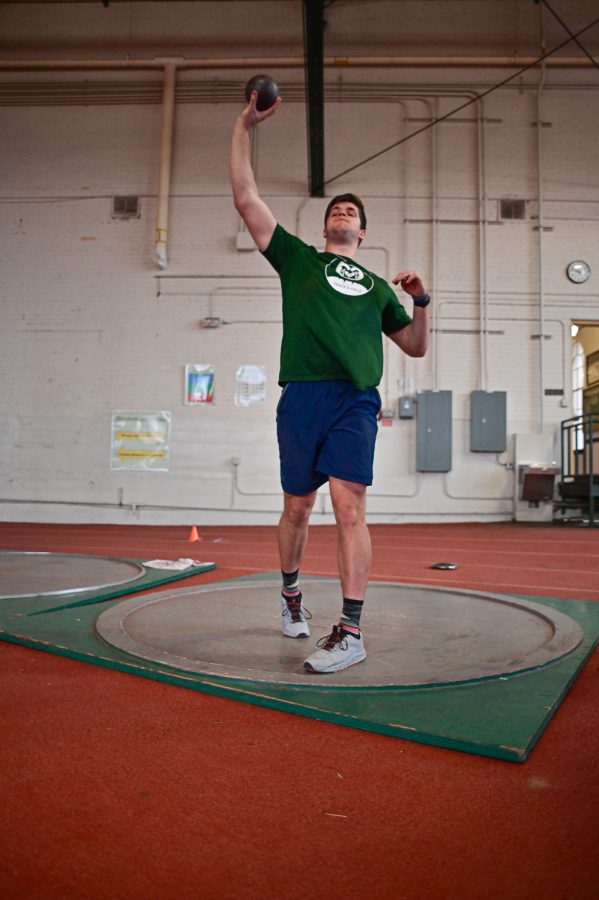 Jackson Morris practice with the outdoor shot put at the Glen Morris Fieldhouse Feb. 14.
