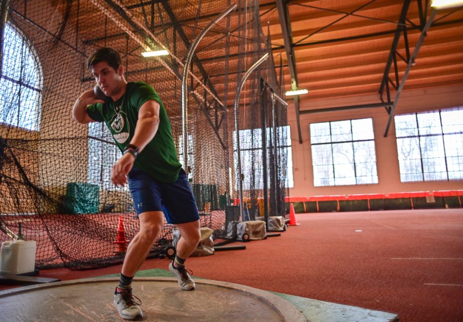 Jackson Morris, Colorado State University track and field athlete, practice with the outdoor shot put at the Glen Morris Fieldhouse Feb. 14.