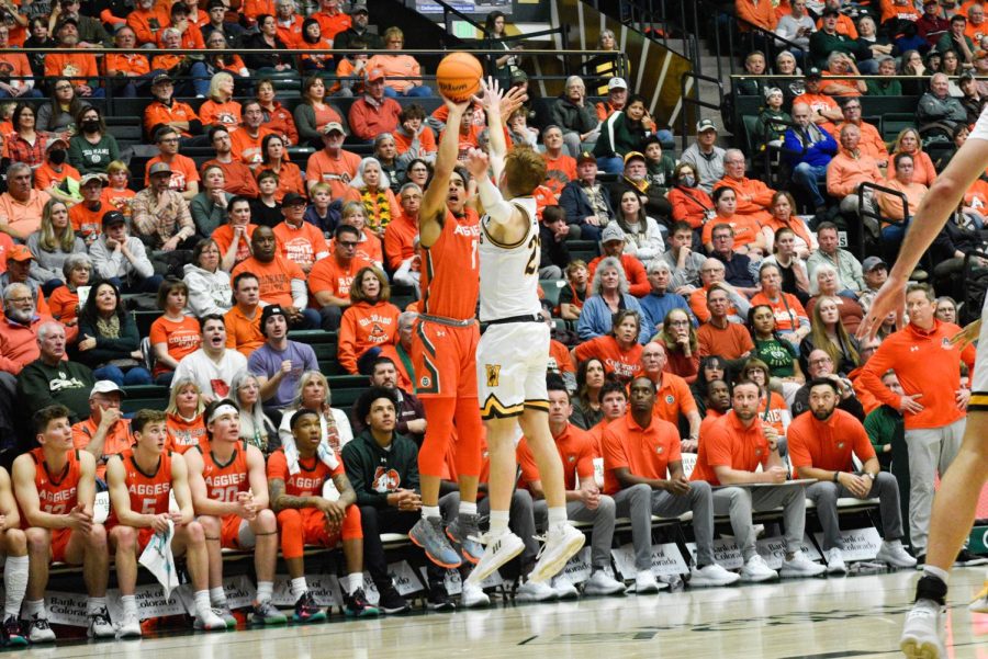 Guard John Tonje (1) shoots a three-pointer during the Border War game against the University of Wyoming at Moby Arena Feb. 24. Tonje was the top scorer for the Rams, earning 25 points towards the Rams 84-71 win over the Cowboys. 
