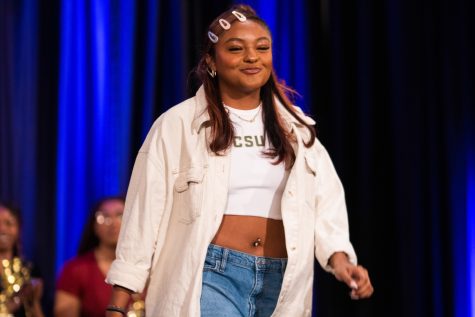 Teja, a model for the 2023 United Women of Color Hair Show, struts down the runway at the Lory Student Center Ballroom D Feb. 26.