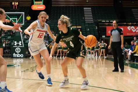 Colorado State University basketball guard, McKenna Hofschild (4), defends the ball against an opponent from Boise State University at Moby Arena Feb. 28. CSU won 66-51.