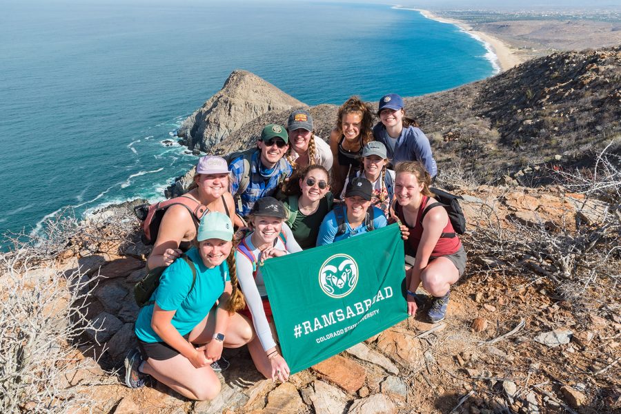 Colorado State University students pose with a CSU Abroad flag in Todos Santos, Mexico. The Todos Santos Center in Baja California Sur is a global extension of the Colorado State main campus that provides a study abroad opportunity each semester. Photo Courtesy of Colorado State University.  
