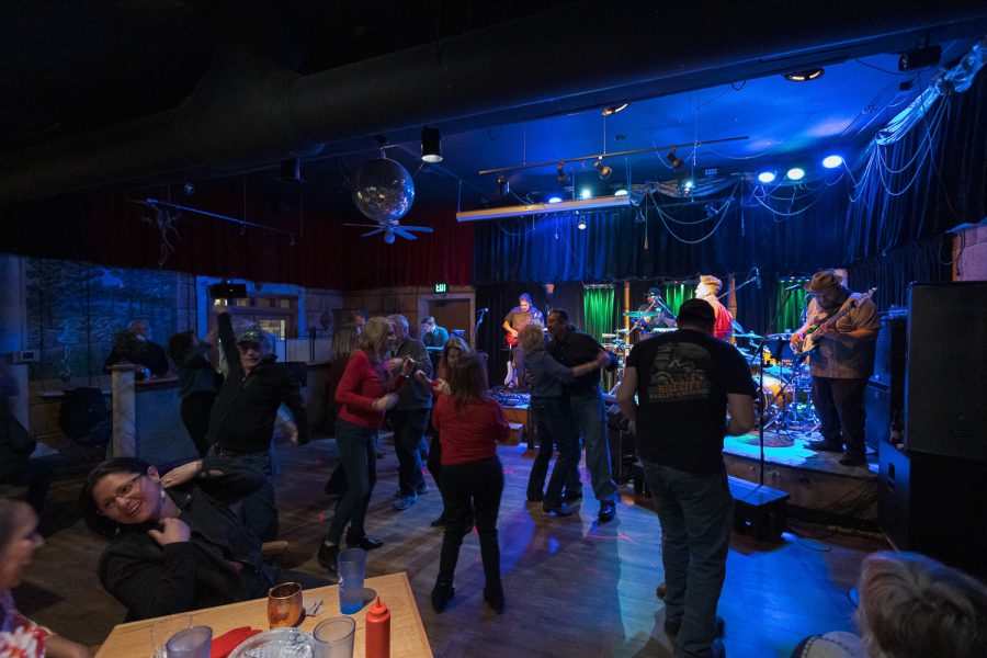 Concertgoers dance as Fort Collins-based band Persuasion performs The House Is Rockin at Avogadros Number Feb. 11.