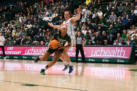 Guard Cailyn Crocker (32) makes a drive to the basket against Boise State Universitys Natalie Pasco (32) during a home game at Moby Arena