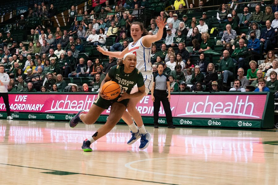 Guard+Cailyn+Crocker+%2832%29+makes+a+drive+to+the+basket+against+Boise+State+Universitys+Natalie+Pasco+%2832%29+during+a+home+game+at+Moby+Arena