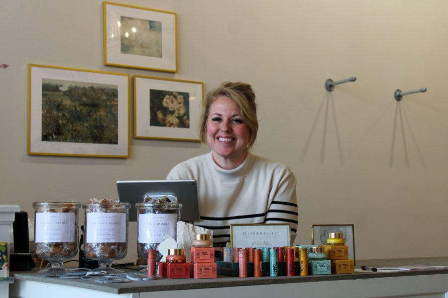 The owner of Blush Boutique, Emilie Casseday, smiles behind the counter of her new store Mar. 6. Blush was started in Greeley and recently moved to Ft. Collins hoping to spread a message. My mission is to really love the people who walk through the door, Casseday said. When I started Blush that wasnt really what I was going for but throughout the process Ive realized that I want people to feel seen when they walk in the door.