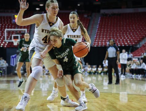 Colorado State University guard McKenna Hofschild (4) pushes against University of Wyoming center Allyson Fertig (45) in the semifinals game of the 2023 Mountain West Basketball Championships in the Thomas & Mack Center in Las Vegas March 7. The Rams lost 65-56 to end their tournament run.