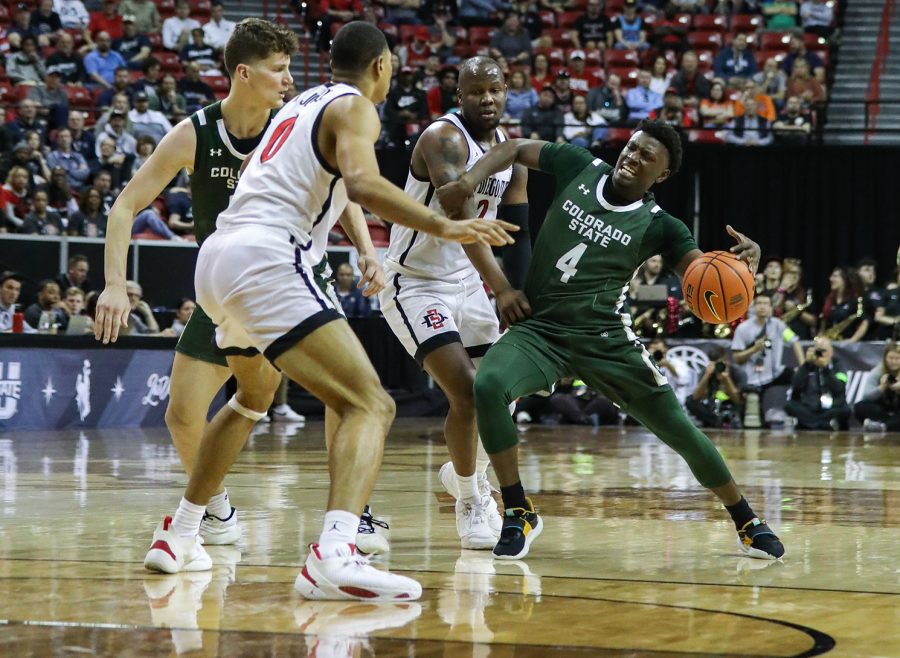 Colorado State University guard Isaiah Stevens (4) fights to keep possession of the ball around a San Diego State University double team in the Thomas & Mack Center in Las Vegas March 9, 2023. The Rams lost 64-61 to No. 1 SDSU in the quarterfinals of the 2023 Mountain West Basketball Championships.