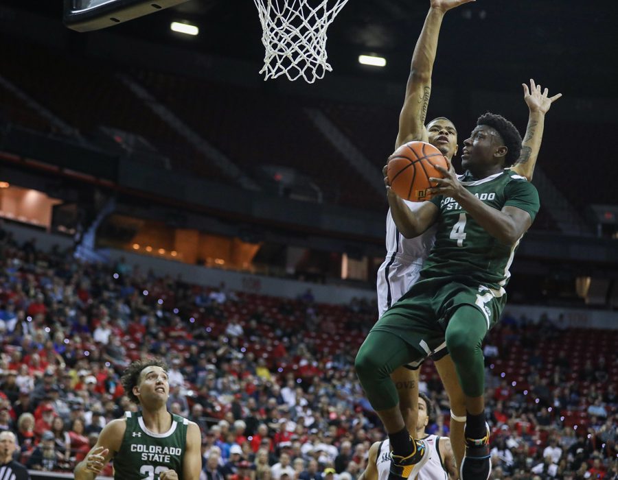 Colorado State University guard Isaiah Stevens (4) flies to the basket as San Diego State University forward Keshad Johnson (0) attempts to block the shot in the Thomas & Mack Center in Las Vegas March 9, 2023. The Rams lost 64-61 in the quarterfinals of the Mountain West Basketball Championships.