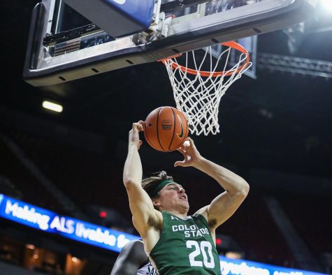 Colorado State guard Joe Palmer (20) grabs a rebound in the Thomas & Mack Center in Las Vegas March 9. The Rams lost 64-61 to San Diego State in the quarterfinals of the 2023 Mountain West Mens Basketball Championship.