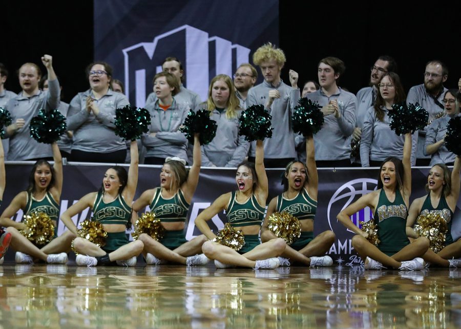 The Colorado State University cheerleaders, Golden Poms and pep band cheer on the Rams in the Thomas & Mack Center in Las Vegas March 9, 2023. The Rams lost 64-61 to San Diego State University in the quarterfinals of the 2023 Mountain West Basketball Championships.