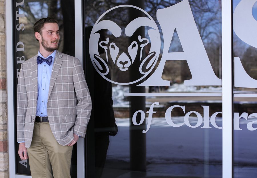 Hayden Taylor looks to the Associated Students of Colorado State University sign outside their offices on The Plaza March 28, 2023. Taylor is running for the speaker of the senate position for the 2023-24 school year.