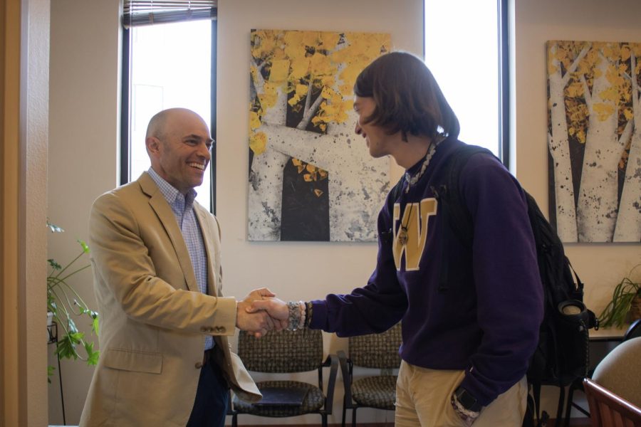 Shawn Bingham shakes hands with a member of the Colorado State University honors college in the Academic Village fireside lounge March 24. Bingham is the newly appointed Director of the University Honors Program. “The first thing out of my mouth typically at any info session …. Throw out all your ideas about honors because hopefully this is not going to be that- it’s a community, and it’s a really supportive one, said Bingham. 
